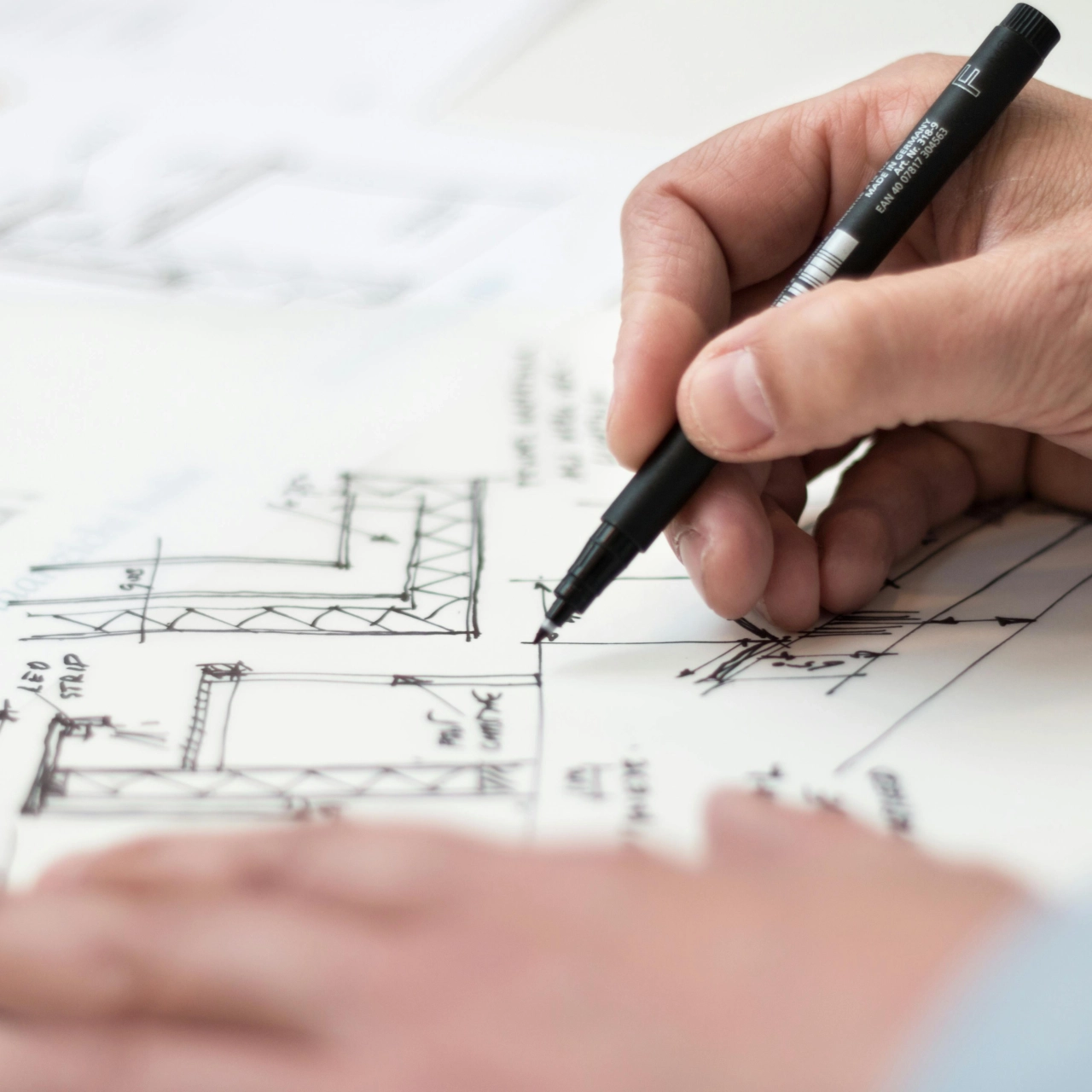 Person Holding Black Pen